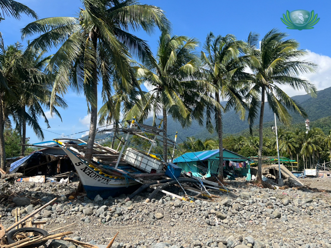 Typhoon Uwan’s powerful storm surges slammed boats into coconut trees.