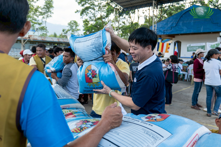 Smiles are exchanged as everyone puts great effort in preparing the relief goods.