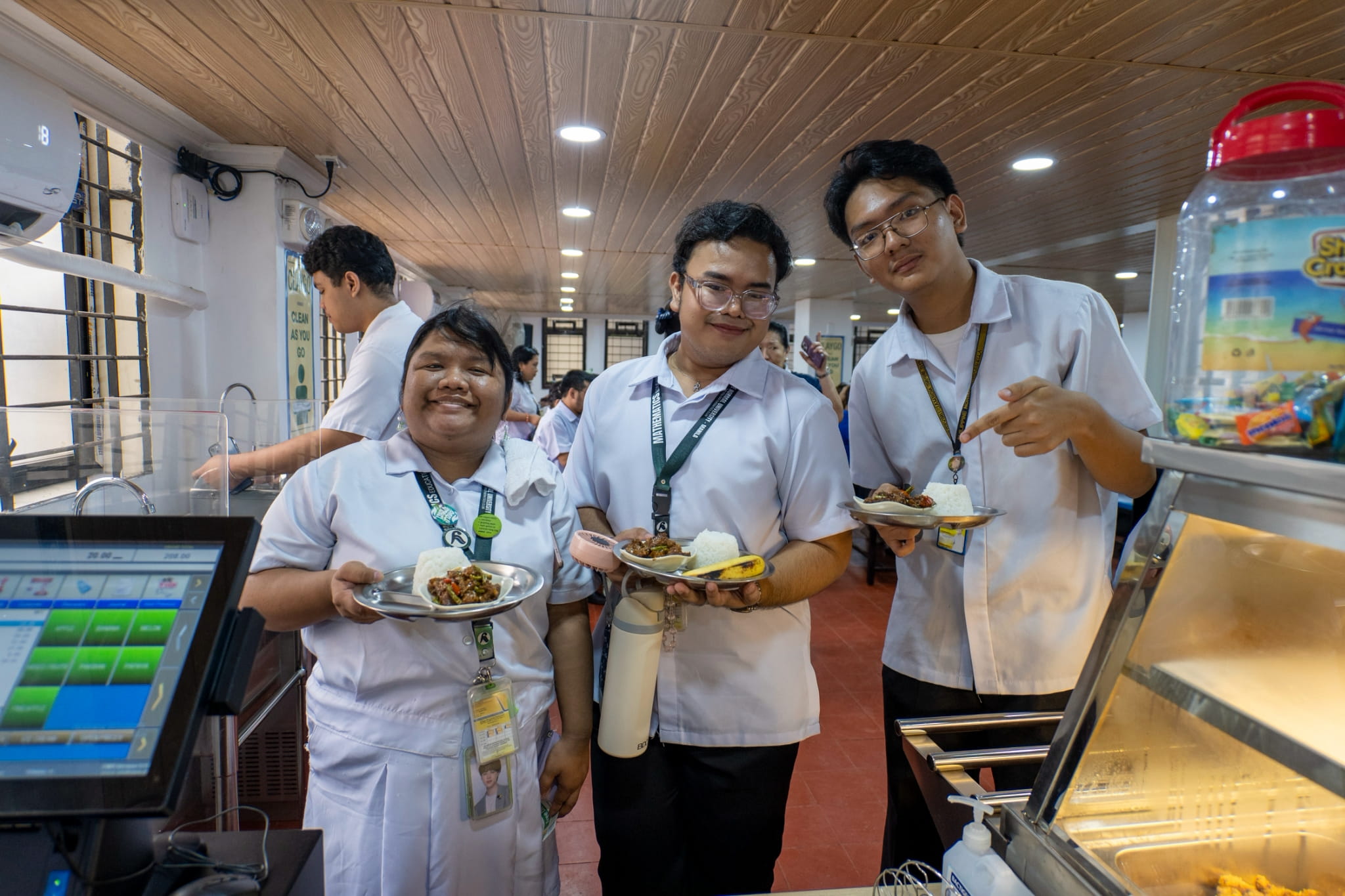 At lunchtime, Renneil Puertollano (center) bought the salpicao with rice, available for ₱65 at the school canteen.  “I think it will become a habit, at least for our friend group, to explore more plant-based meals.”