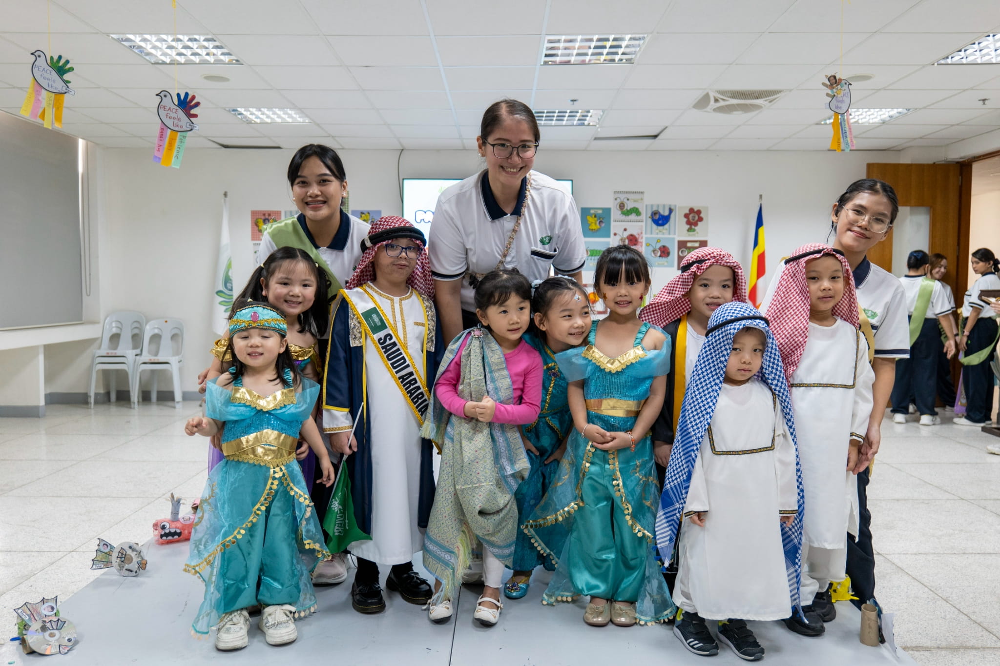 The kindergarten’s little representatives proudly showcase Saudi Arabia!
