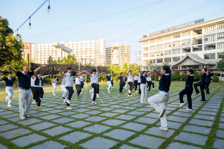 Participants start their day with Tai Chi and Qi Gong, embracing Tzu Chi’s holistic approach to well-being.