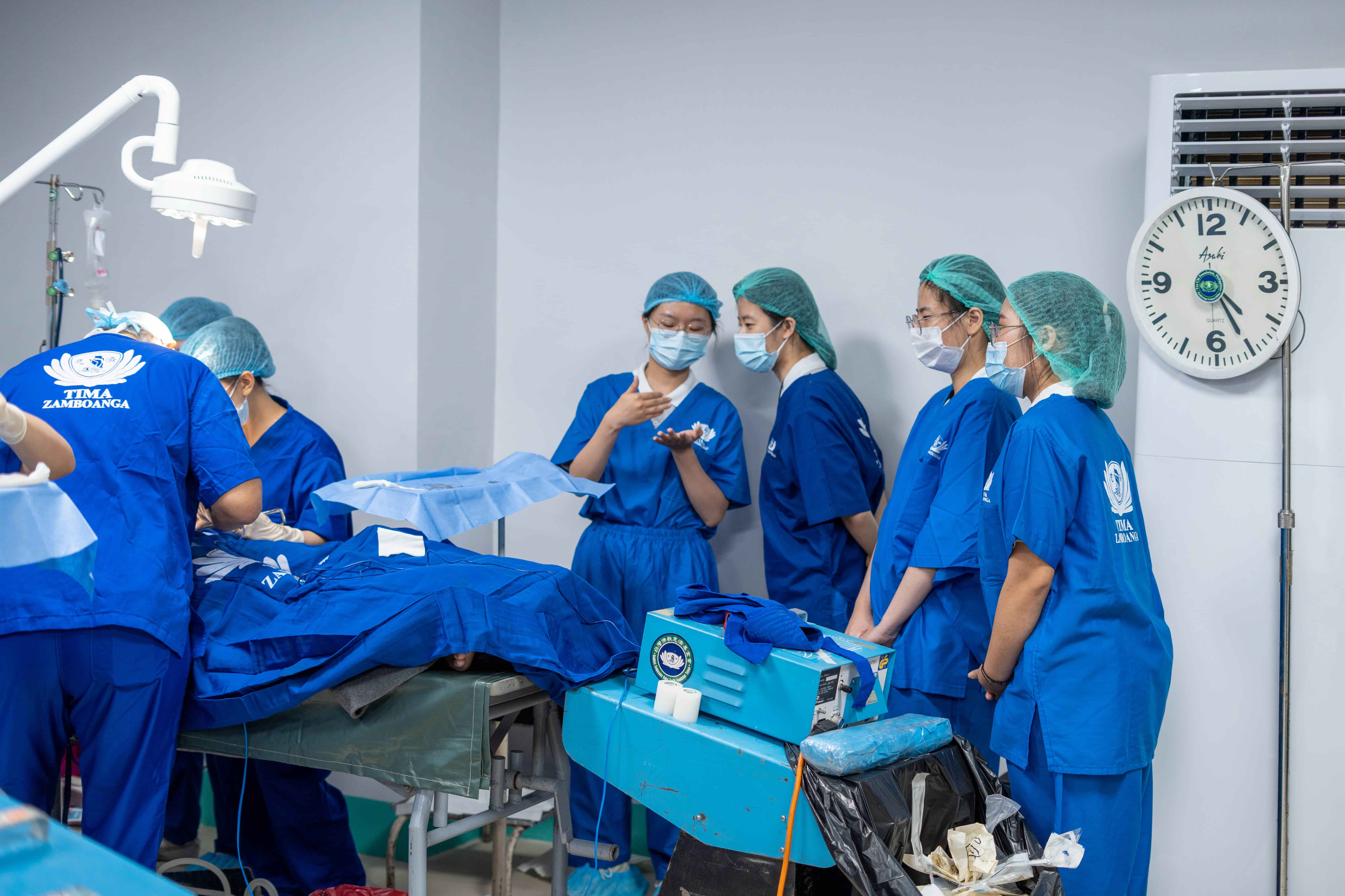 TCU students don full surgical attire to observe a surgical procedure. 