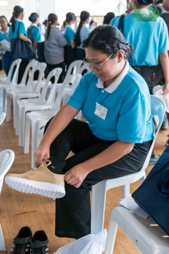 A scholar fits a new pair of sneakers.