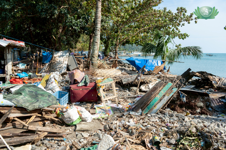 Debris and materials from damaged homes in Paltic, Dingalan,  are gathered in the hopes that residents may be able to use them to rebuild their houses.