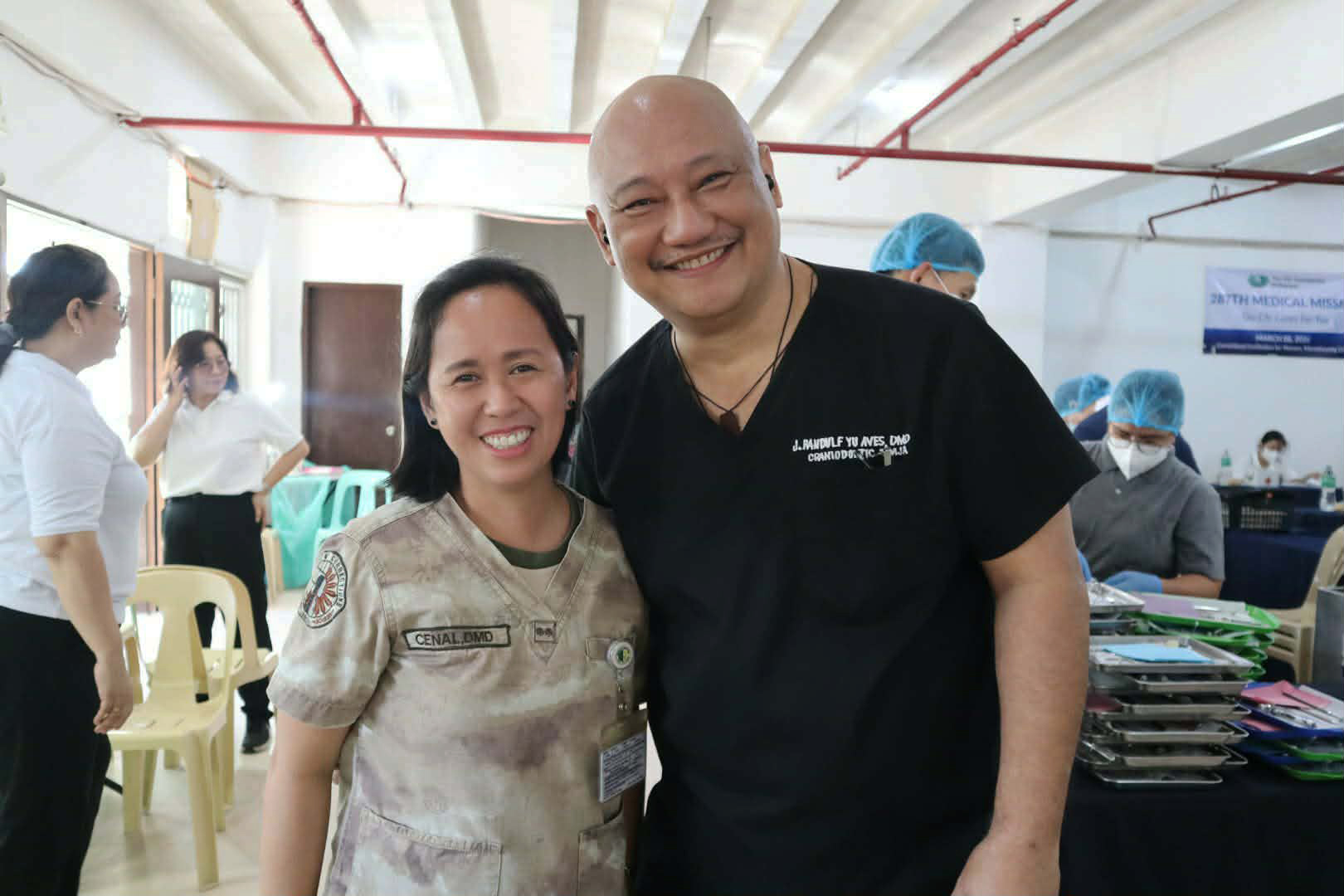Corrections Technical Senior Inspector Kristine B Cenal, DMD (left), poses with fellow dentist, J. Randulf Yu Aves, DMD. 
