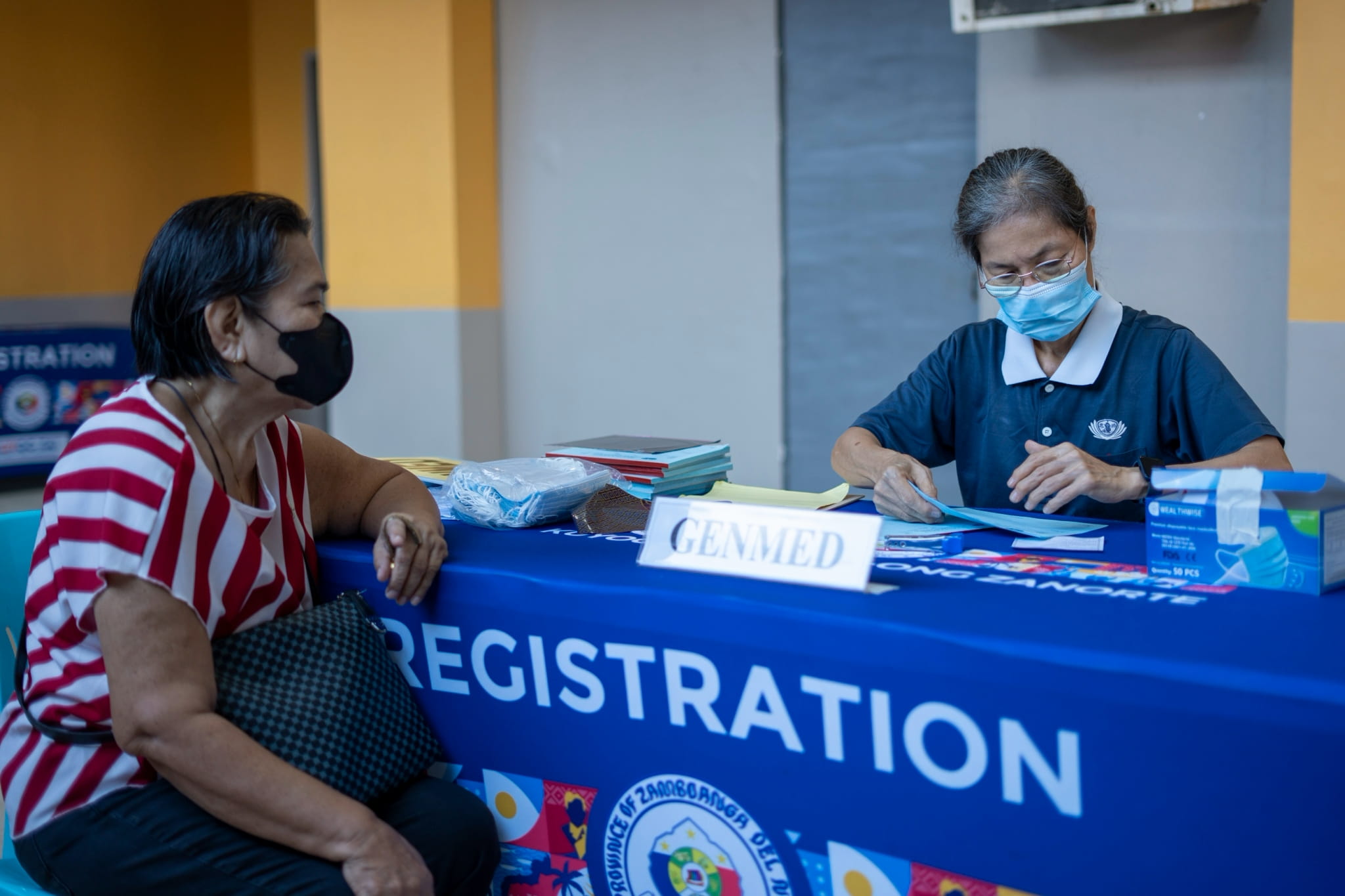 Tzu Chi volunteers efficiently manage the registration table.