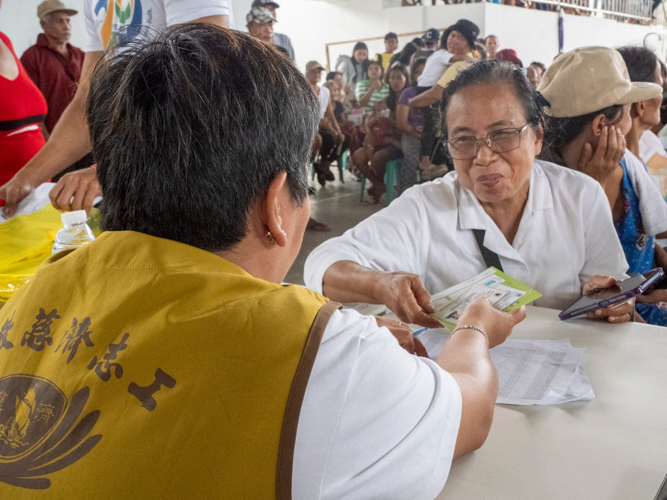 Beneficiaries are happy to receive their relief distribution stubs in Sta. Ana, Cagayan. 