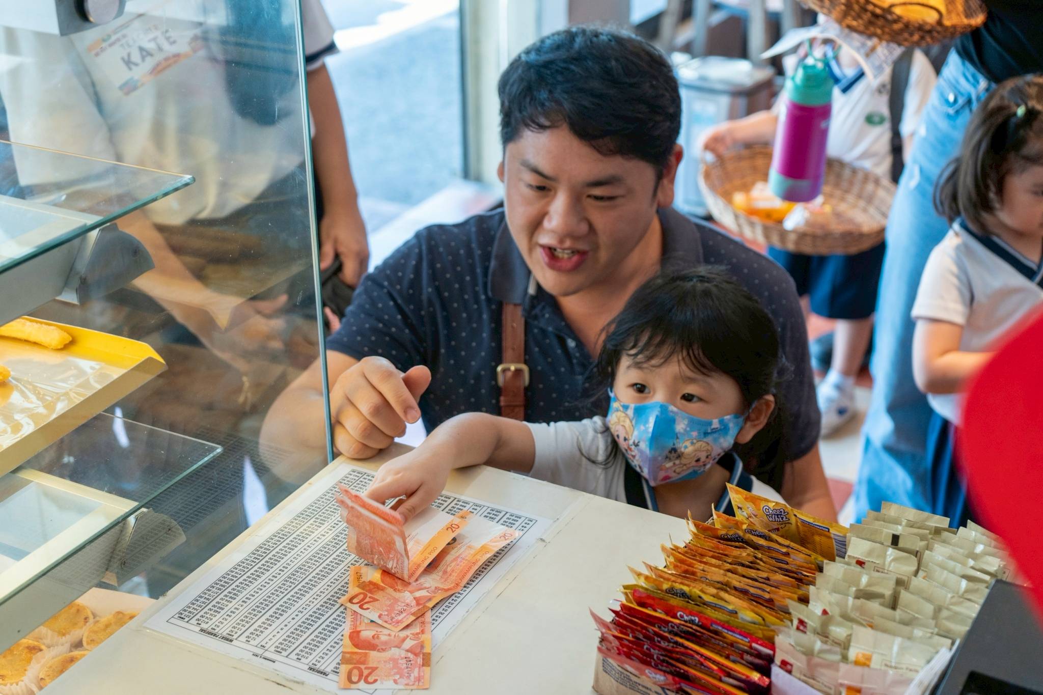 Beyond learning to pay the fare on the jeepney, the children also practiced paying for their purchases themselves at the bread shop. 