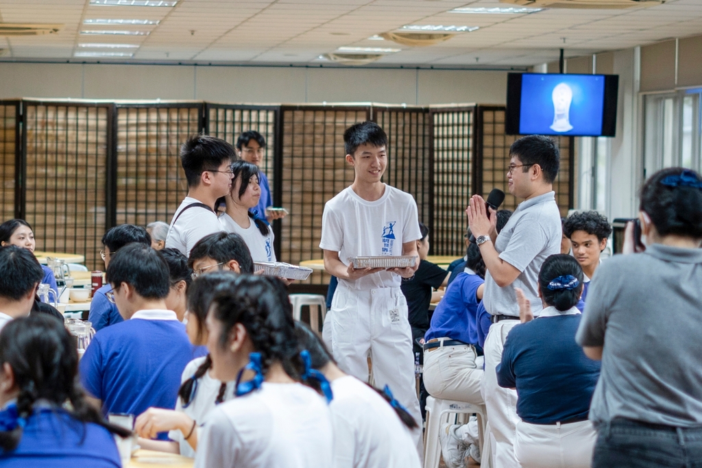 Three birthday celebrants are surprised with a cake during the second day of the induction camp.