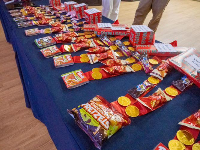 The teachers thoughtfully prepared awards for students made using sweet treats and snacks, which they receive during the awarding.