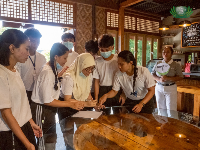 Scholars list down the many recycled and upcycled features of the Tzu Chi café.