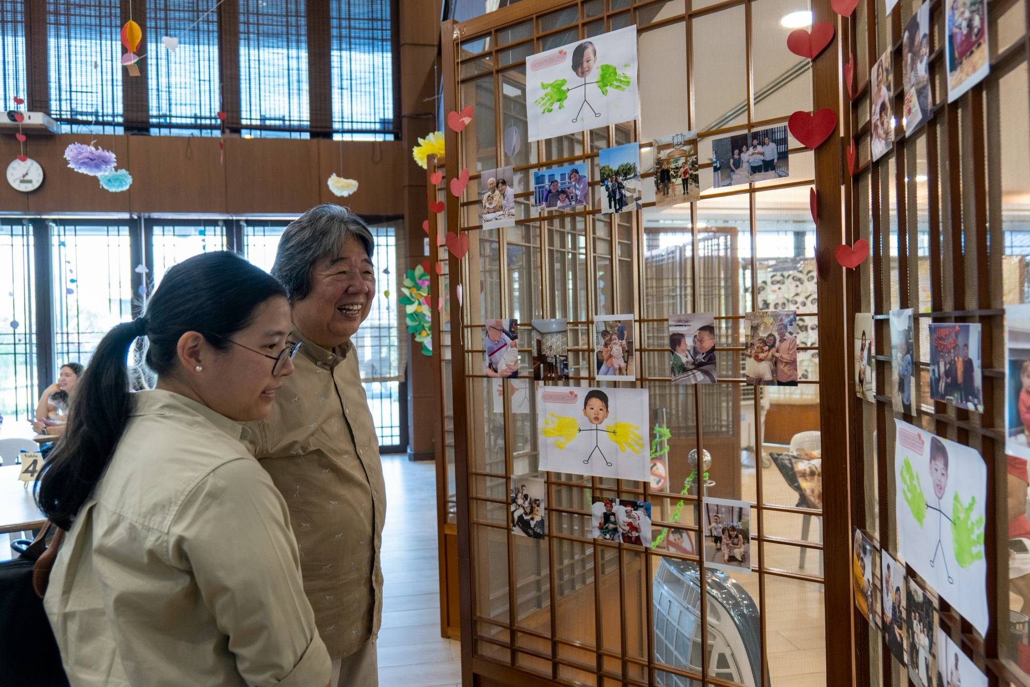 Grandparents adore seeing their favorite photo moments displayed together on a board filled with pictures. 