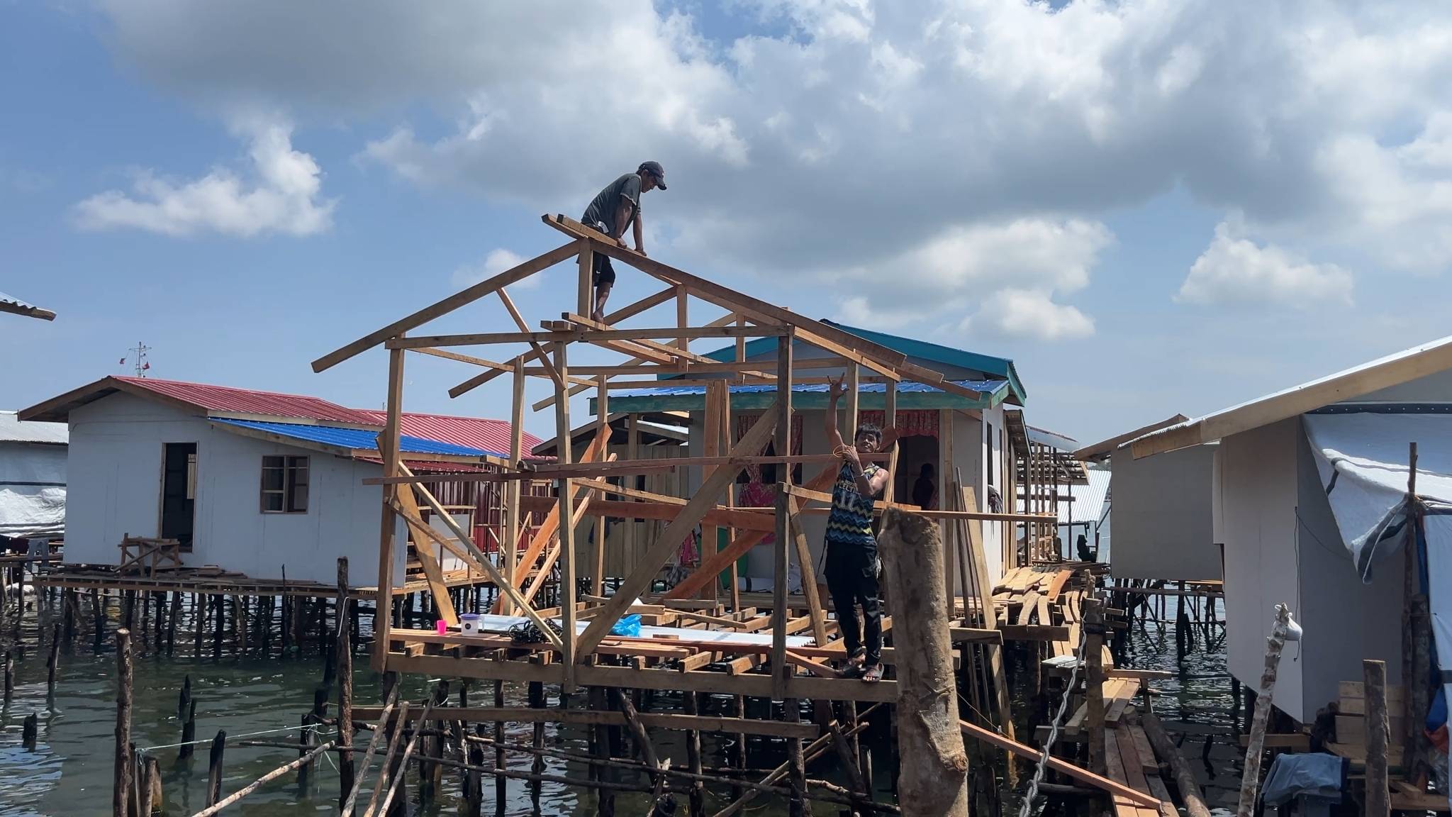 Having lost everything from the fire, residents begin rebuilding their home from the ground up. 
