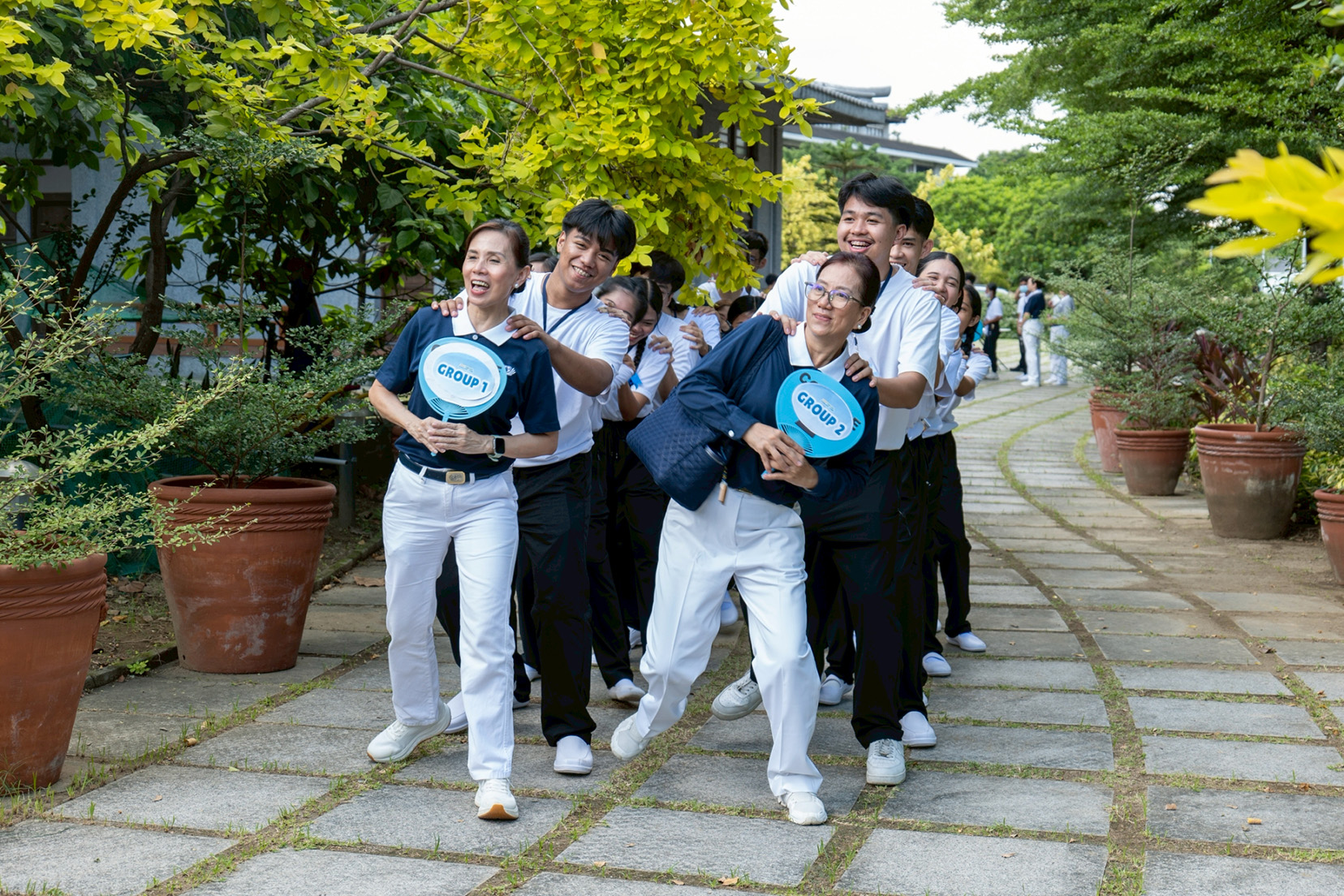 Group leaders and their respective scholars line dance their way to the next “Amazing Race” challenge.