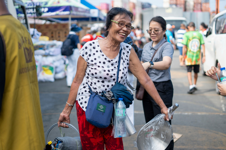 From overwhelming sadness to glee, 66-year-old garlic peeler Teresita Borbon’s smile is priceless after she receives her relief items. “I’m truly grateful. We don’t have to buy anything; everything is already here. Thank you,” Borbon says.