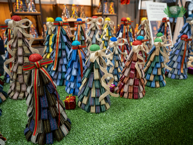 At the Jing Si Auditorium: Residents from Tzu Chi Great Love Village in Palo, Leyte, create Christmas trees use strips of cloth.