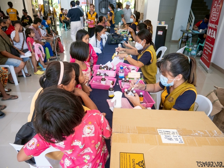 Volunteers dispensed vitamins and medicines for free after patient consultations and check-ups. 