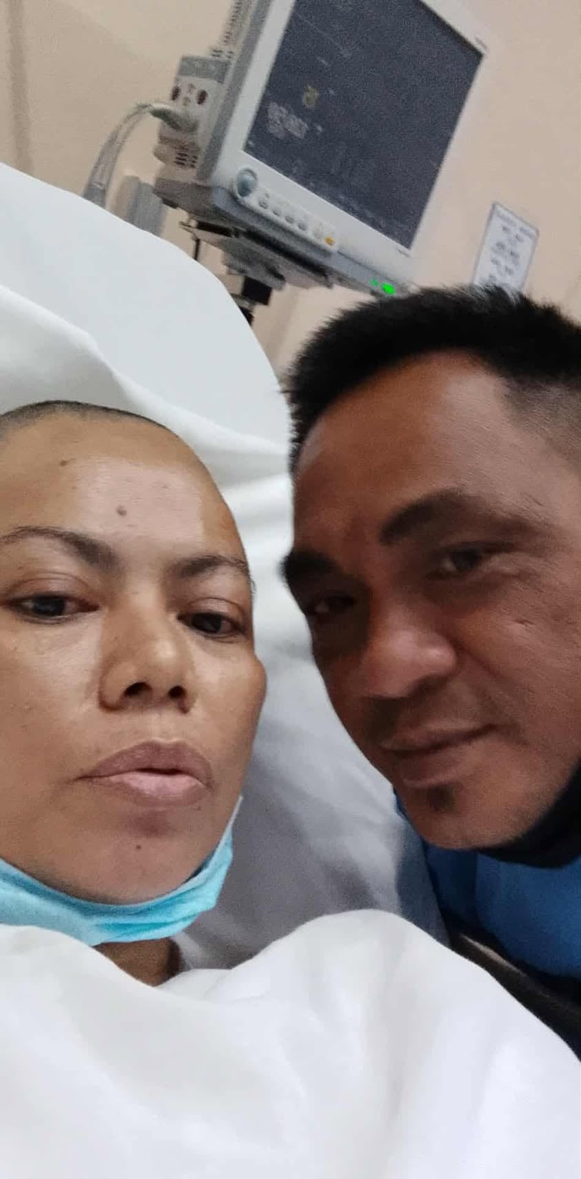 With husband Edison at the Philippine General Hospital, a shaved Roselyn Rodriguez recovers from a successful frontoparietal craniotomy and tumor excision. 
