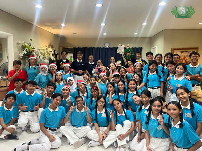 Tzu Chi Zamboanga scholars celebrate their first-place win in the Christmas carol contest, impressing the crowd with their polished debut performance.
