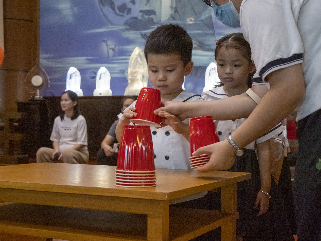 Young students focus on learning how to play the games. 