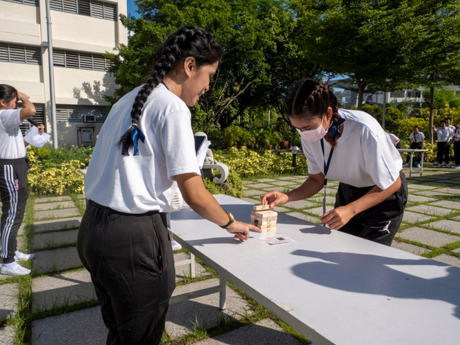 Jenga blocks are used to help build a model of the Jing Si Abode. 