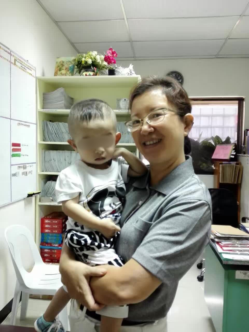 One-year-old Sam Anthony Tan with Tzu Chi volunteer Winnie Uy after his open-heart surgery in April 2017.