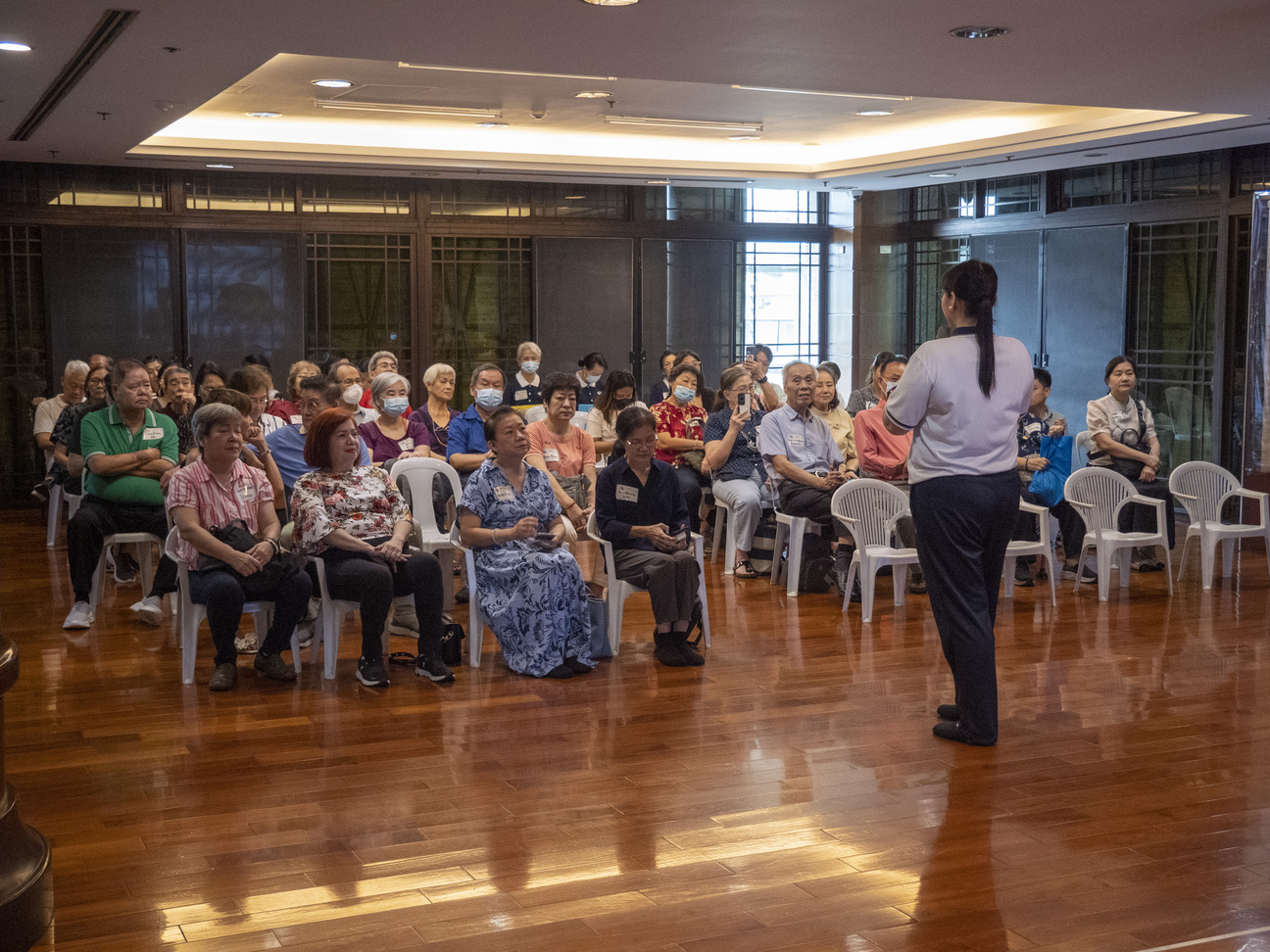 Grandparents sincerely take in the words of appreciation by Tzu Chi Great Love Preschool Philippines Directress Jane Sy, who thanked them for taking good care of the young students.