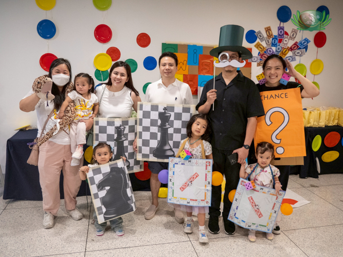 The families behind the “Board Games” station
