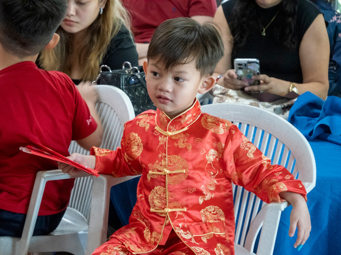 Preschoolers show up sporting their best Chinese attire. 