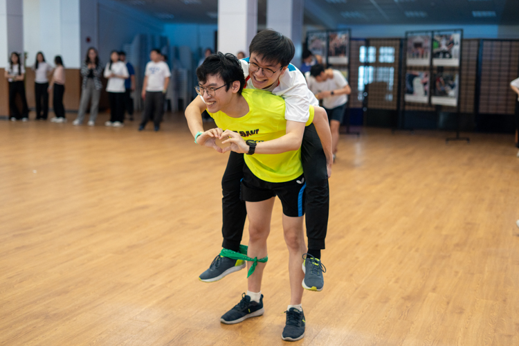 Participants freeze in position during the “Red Light, Green Light” game.