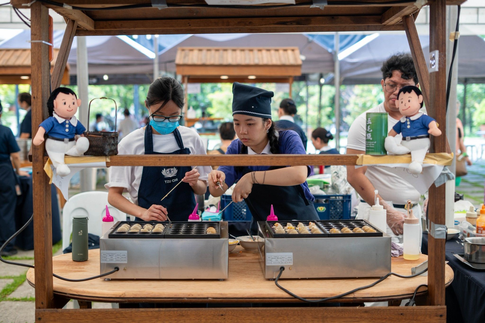 The food bazaar taught Tzu Chi Youth how to persevere in learning a new skill: takoyaki making.