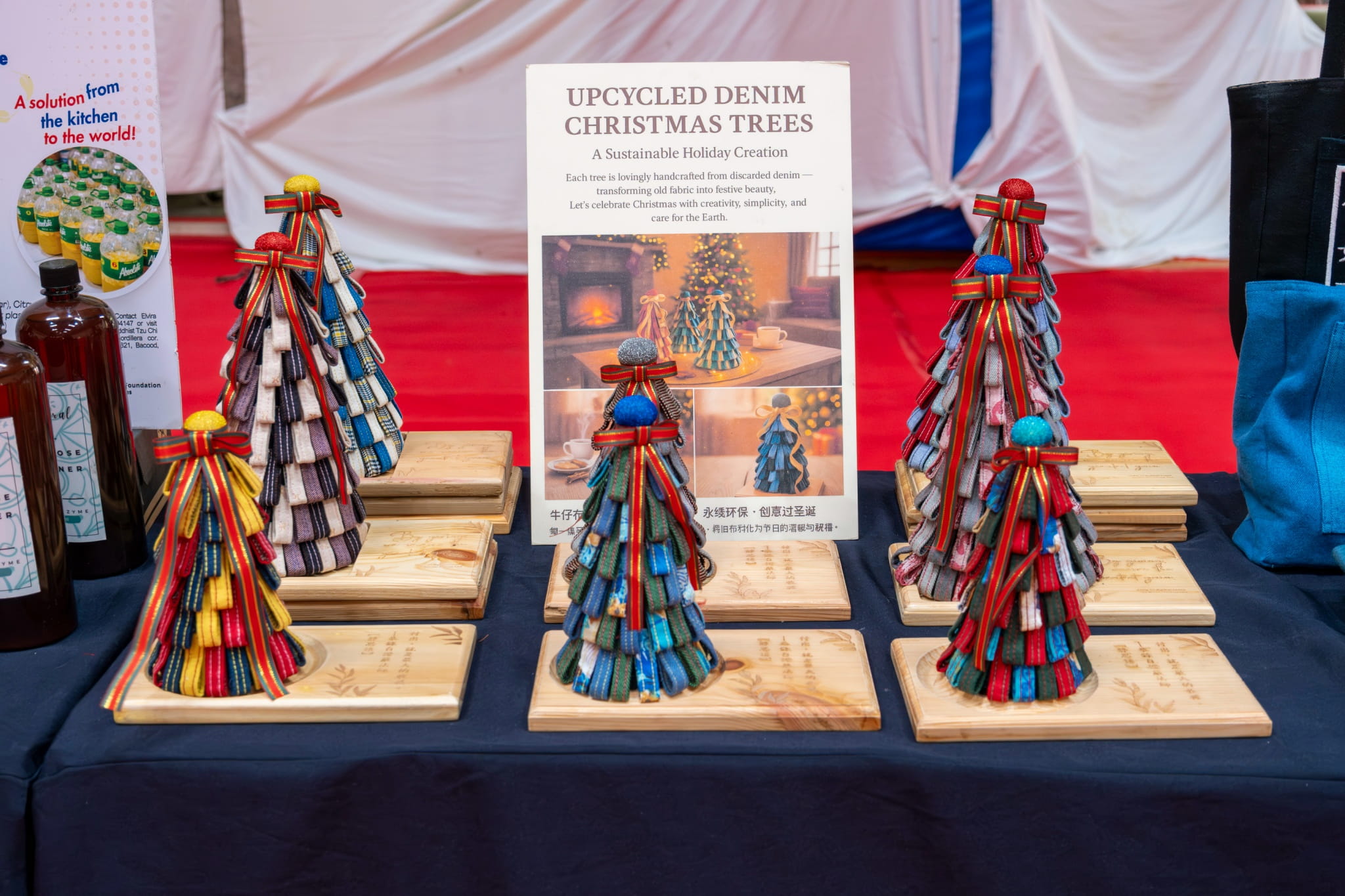 Upcycled denim Christmas trees from Tzu Chi Livelihood in Palo are among the items on sale.