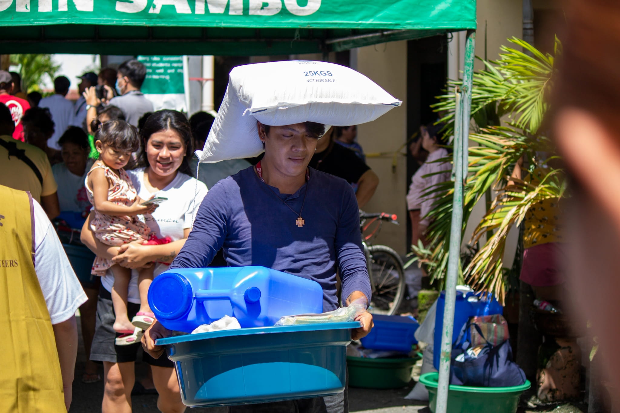 Some beneficiaries were surprised to find themselves carrying home 20 kilograms of rice along with the other relief items.