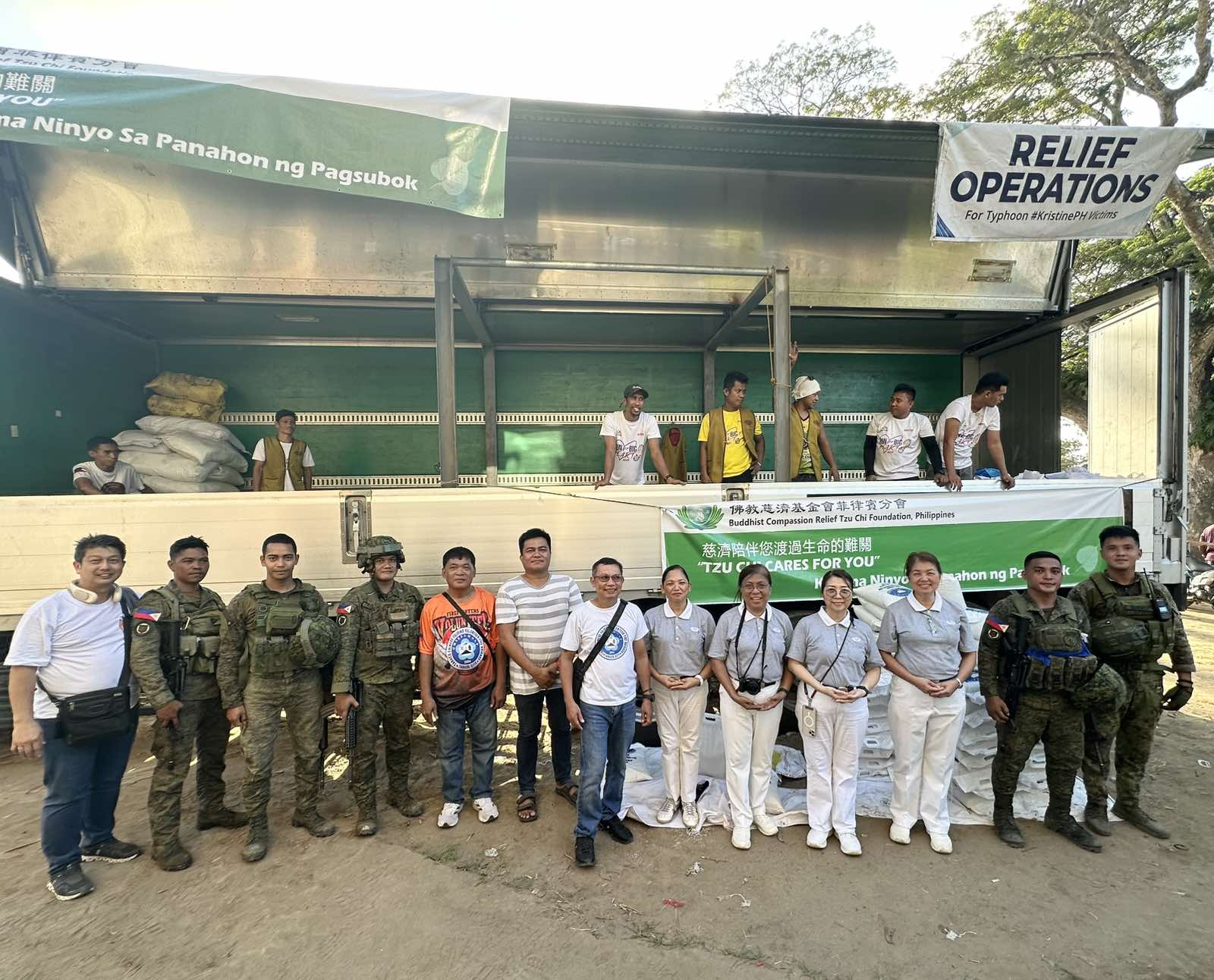 Volunteers pose for a photo after a successful relief distribution. 