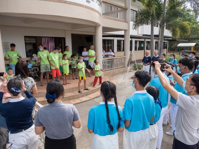 The celebration brings beneficiaries, volunteers, staff, and scholars in shared joy.