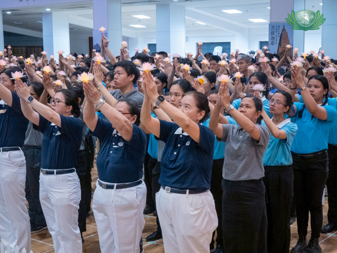 The Buddha Bathing ceremony ends with participants raising their lighted lotus flowers as a sign of love and respect to the Buddha.