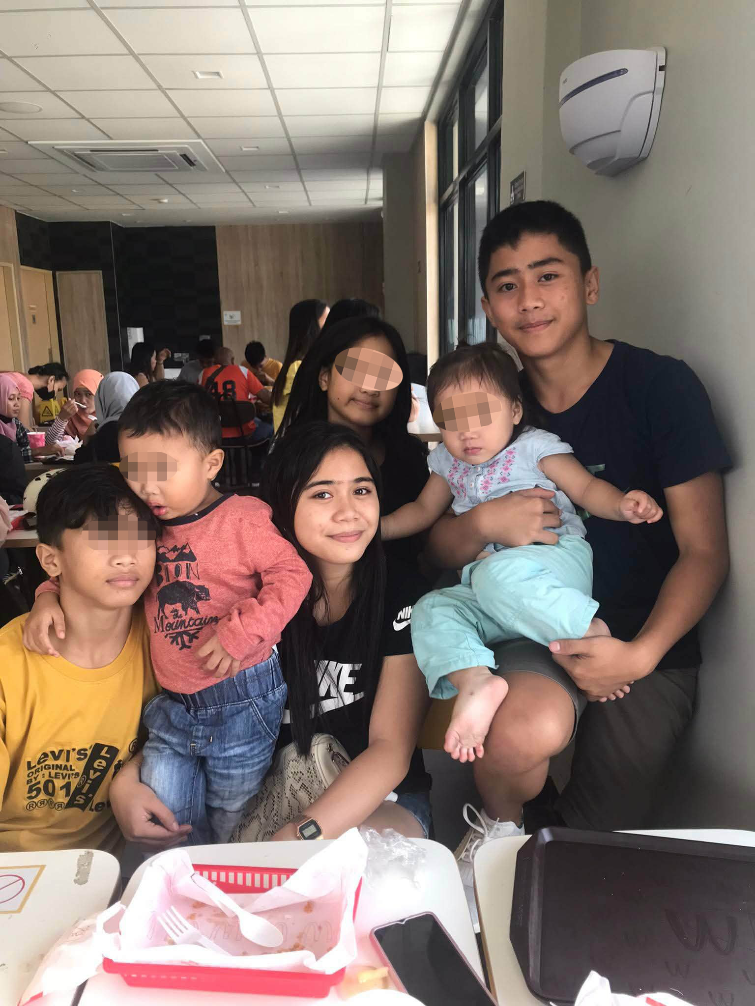 Amid the pressures of college, the young scholar remains a constant presence in his siblings' lives. He makes time to visit and care for them whenever he can.