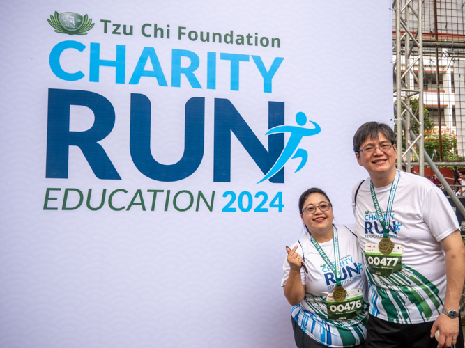 The Tzu Chi Charity Run for Education photo wall was quite popular with the runners and volunteers. 