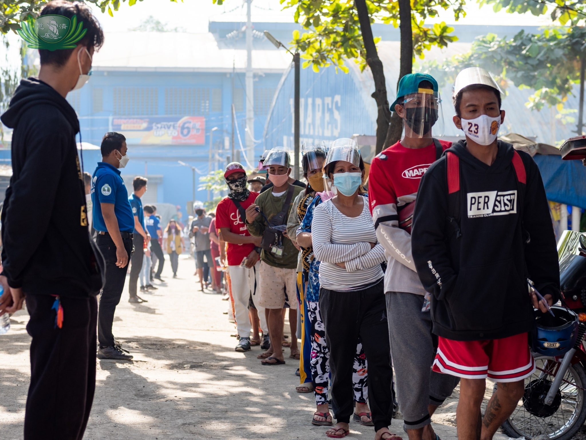 Wearing face masks and face shields and practicing social distancing were observed during the distribution. 