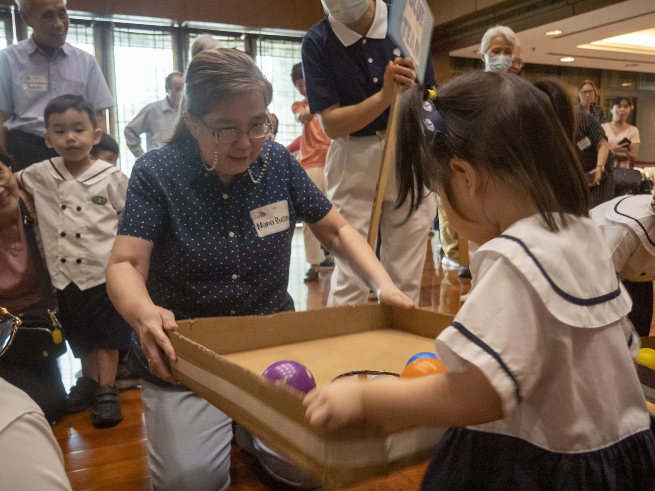 Grandparents and their beloved grandchildren all enjoy the fun games prepared by the teachers, volunteers, and staff. 