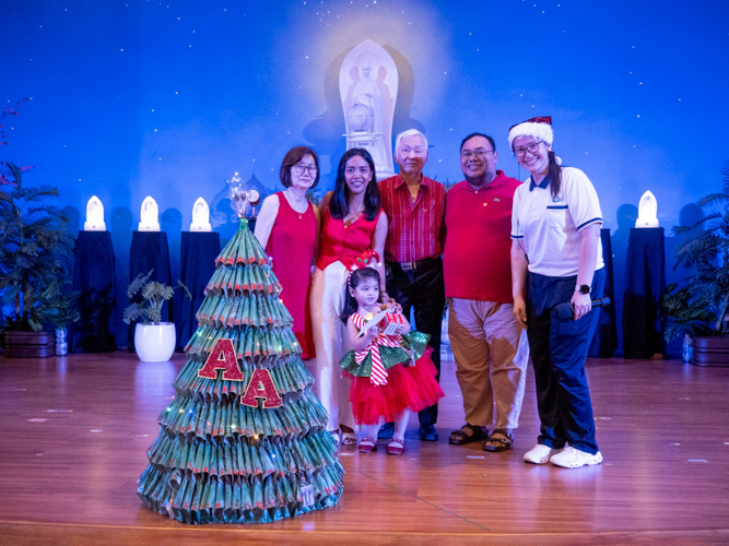 Showing off their eco-friendly tree made using recycled newspapers, the pre-kindergarten student receives the Eco Warrior Champion (Nursery Division) award for her resourcefulness.