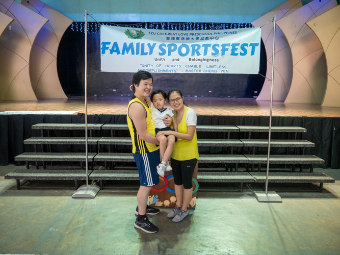 Mark Fang (left), Joanne Fang (right), together with their son Matthew (center) happily pose for a photo during the family sports fest.