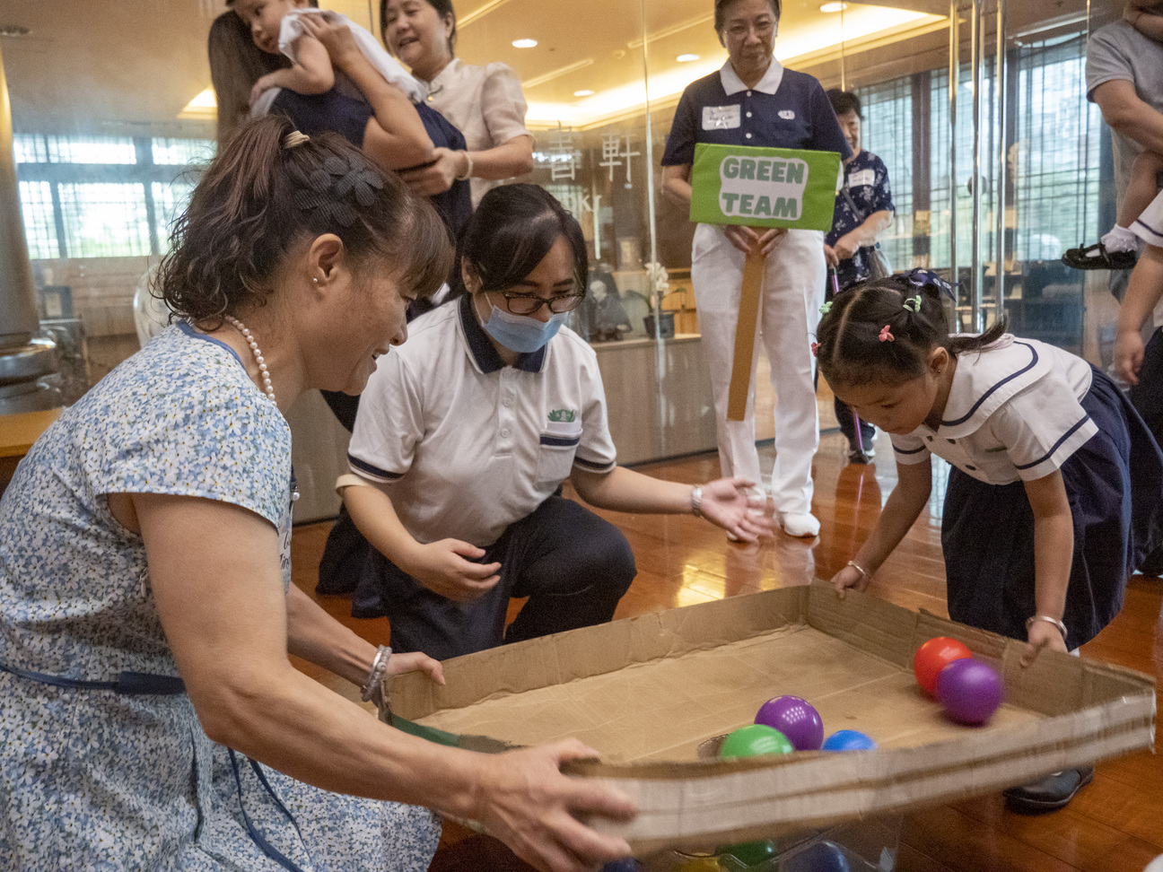 Grandparents and their beloved grandchildren all enjoy the fun games prepared by the teachers, volunteers, and staff. 