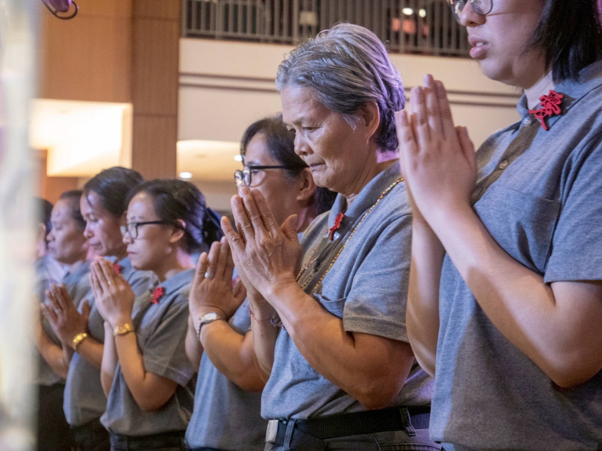 Tzu Chi staff stepped out of their offices and into the celebration, joining the community in a solemn moment of prayer and reflection.