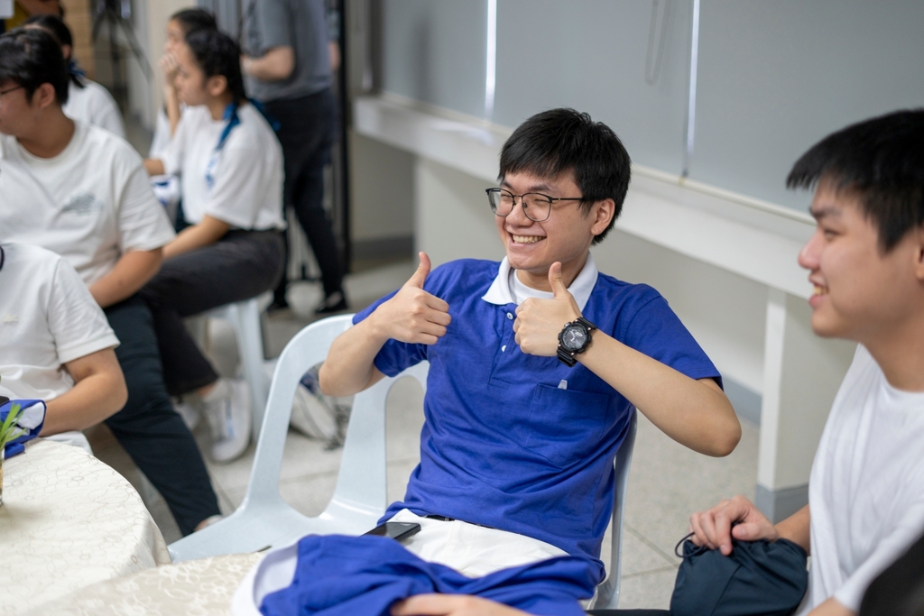 Jeremy Concio proudly wears his Tzu Chi Youth uniform.