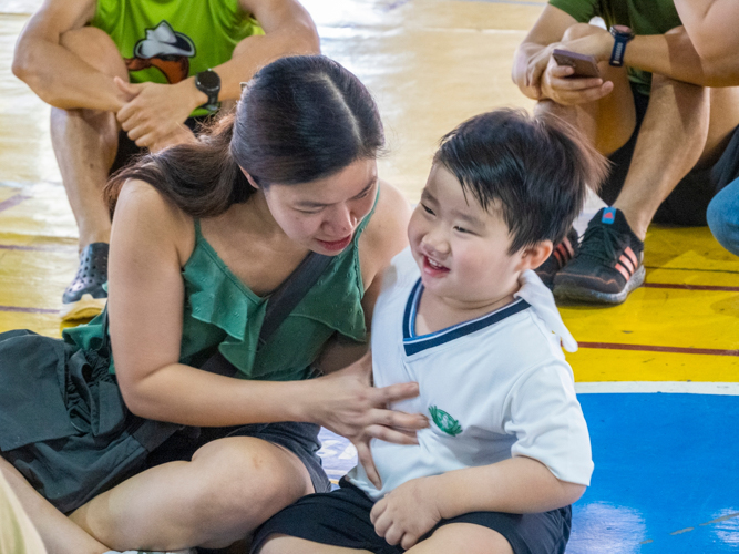 Parent Lalaine Ong (left) spends quality time with son Lance (right) during the family sports fest.