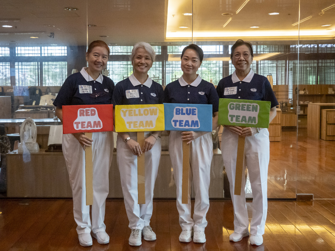 Tzu Chi volunteers enjoy helping in the fun games.