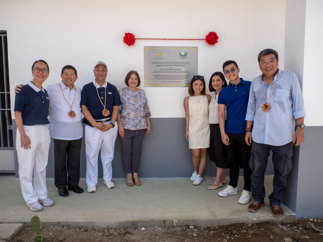 Representatives from Angelo King Foundation Inc., led by President Teddy Kingsu (second from left), and Tzu Chi Philippines CEO Henry Yuñez (third from left) pose together at the unveiling of the plaque at the livelihood center.