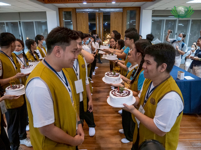 After dinner, scholar-organizers surprise June celebrants with their own birthday cake.