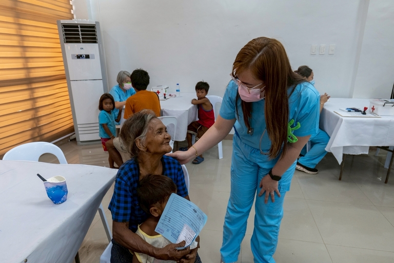 Carmila Bato-Bato said her youngest daughter, the mother of Angela and Angelo, died over a year ago. Since then, she has been caring for her grandchildren, bringing them to the medical mission due to recurring fevers.
